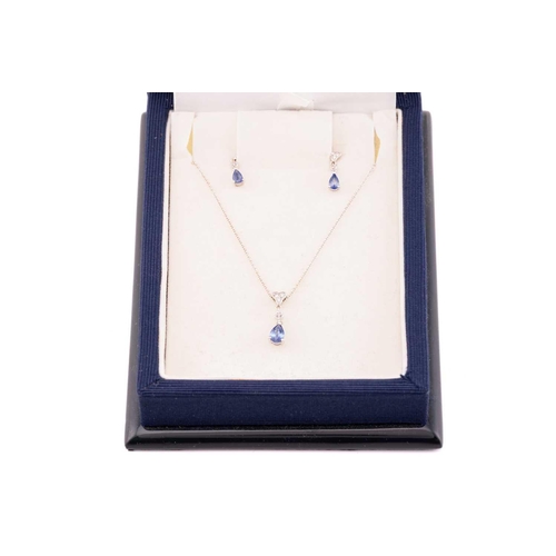 15 - A sapphire and diamond necklace and earrings en-suite; the necklace comprises a pear-shaped sapphire... 