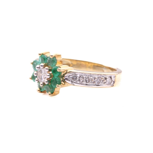 152 - An emerald and diamond cluster ring; the seven stone cluster with central round brilliant cut diamon... 