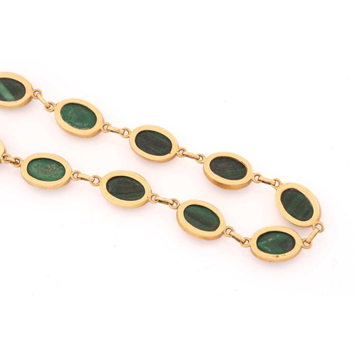 159 - A malachite pendant and bracelet, the pendant comprises a navette-shaped malachite cabochon set in c... 