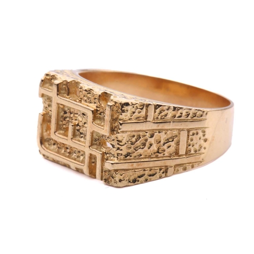 161 - A modernist abstract ring, the rectangular ring head comprises geometrical designs on a textured gro... 