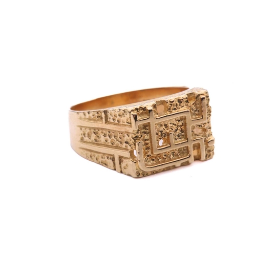 161 - A modernist abstract ring, the rectangular ring head comprises geometrical designs on a textured gro... 