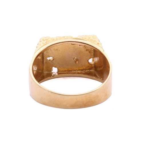 161 - A modernist abstract ring, the rectangular ring head comprises geometrical designs on a textured gro... 