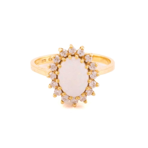 165 - An opal cluster ring and a pair of matching earrings, the ring with oval cabochon opal, approximatel... 