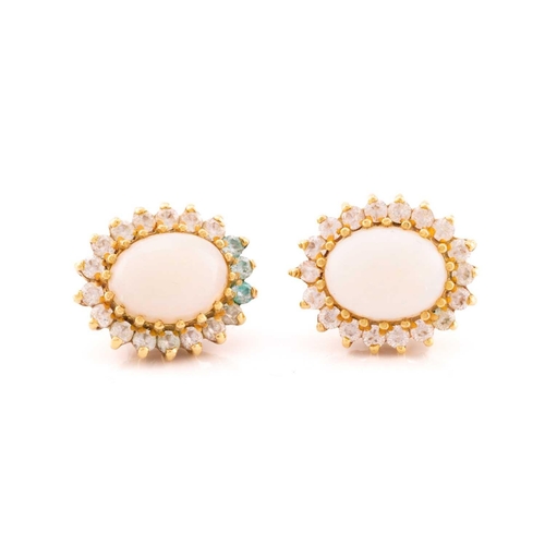 165 - An opal cluster ring and a pair of matching earrings, the ring with oval cabochon opal, approximatel... 