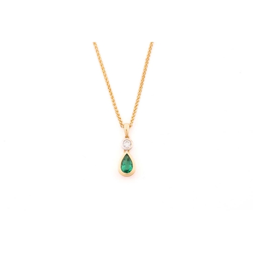 169 - An emerald and diamond pendant necklace and an emerald and diamond ring set in 18ct gold, the ring c... 