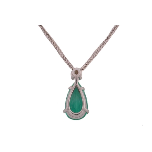 170 - An emerald and diamond pendant on chain, featuring a pear-cut emerald with bright green body colour,... 