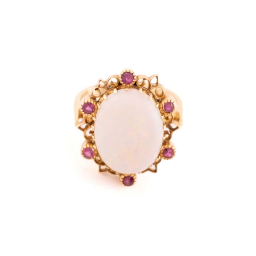 178 - A precious opal dress ring, featuring an oval precious opal cabochon of 16.0 x 12.2 x 4.7 mm, with s... 