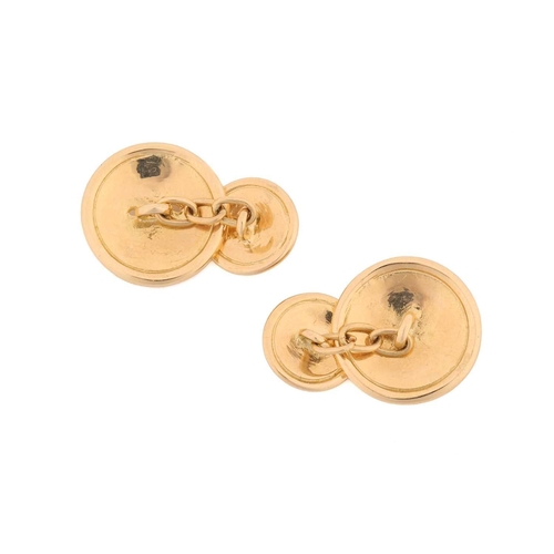 179 - A pair of flat sew-through button cufflinks, round panels connected by cable links, yellow metal mar... 