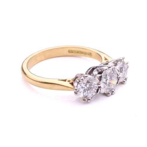 181 - A three-stone diamond half-hoop ring in 18ct gold, comprising three graduated circular brilliant-cut... 