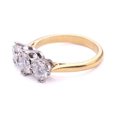 181 - A three-stone diamond half-hoop ring in 18ct gold, comprising three graduated circular brilliant-cut... 