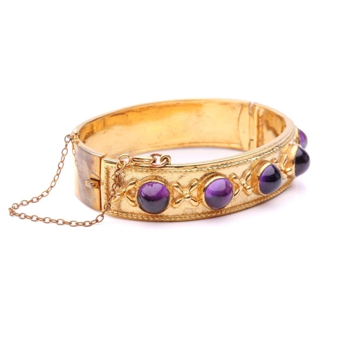 187 - A Late Victorian five-stone amethyst hinged bangle, comprising five high-domed amethyst cabochons in... 