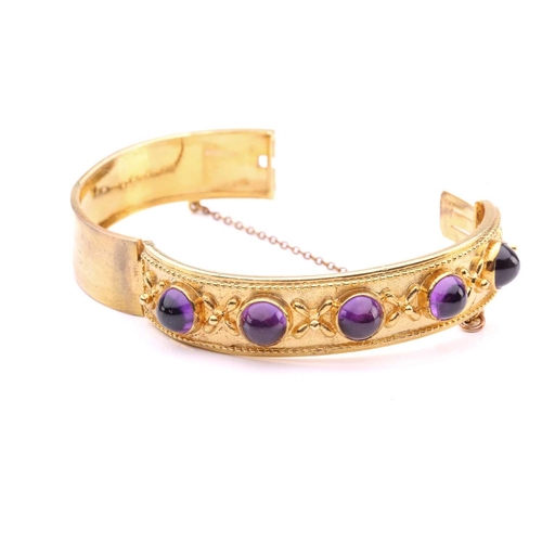 187 - A Late Victorian five-stone amethyst hinged bangle, comprising five high-domed amethyst cabochons in... 