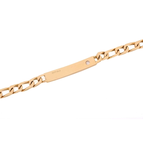 190 - A yellow metal ID bracelet set with a diamond accent, consisting of a flat curb chain attaching a cu... 