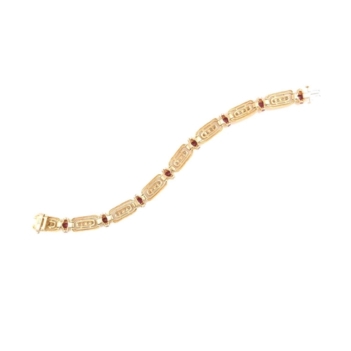 197 - A 14ct yellow gold, diamond, and ruby bracelet, the rectangular-shaped segments each inset with a ro... 