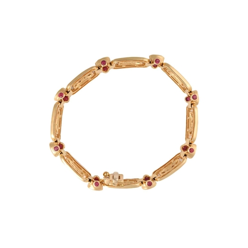 197 - A 14ct yellow gold, diamond, and ruby bracelet, the rectangular-shaped segments each inset with a ro... 