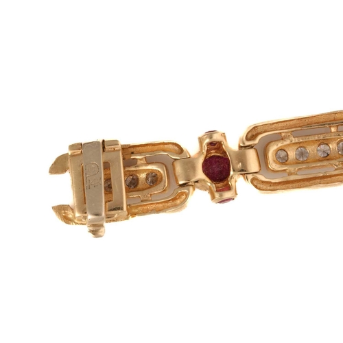 197 - A 14ct yellow gold, diamond, and ruby bracelet, the rectangular-shaped segments each inset with a ro... 