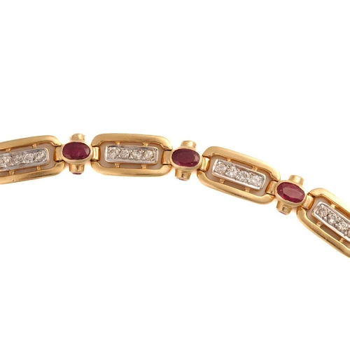 197 - A 14ct yellow gold, diamond, and ruby bracelet, the rectangular-shaped segments each inset with a ro... 