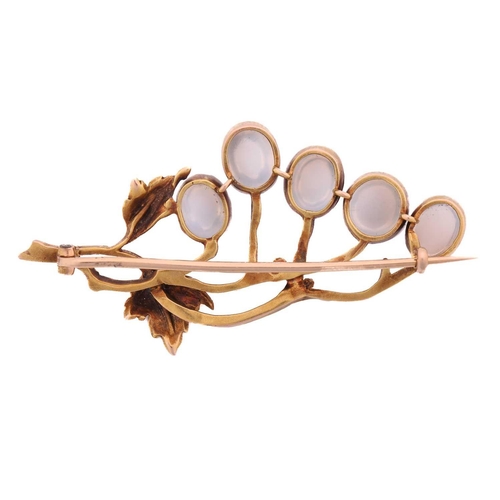 20 - An Art Nouveau-style moonstone vine brooch, consisting of five moonstone cabochons set against scrol... 