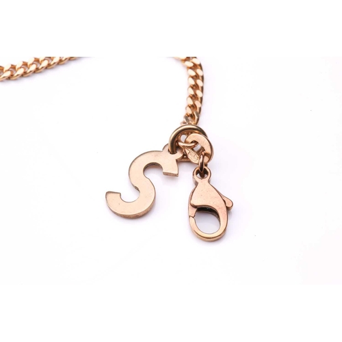 201 - A 9ct gold alphabet pendant on curb link chain, the 'S' charm bears London assay marks, 1979, drop l... 