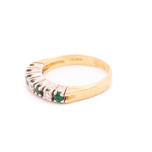 210 - A seven-stone emerald and diamond half-hoop ring, with circular-cut emeralds alternating with diamon... 