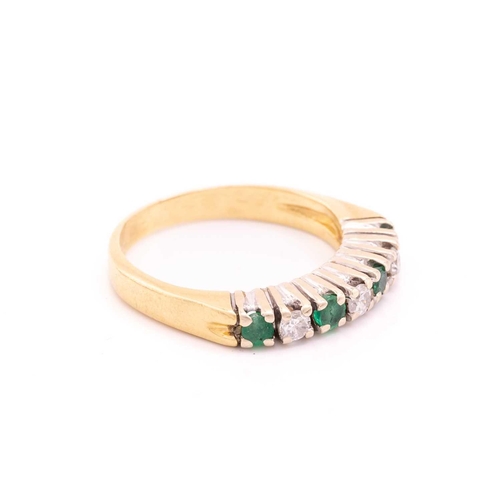 210 - A seven-stone emerald and diamond half-hoop ring, with circular-cut emeralds alternating with diamon... 