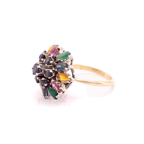 212 - A gem-set flower dome ring, centred with a tiered cluster of circular-cut sapphires, surrounded by a... 