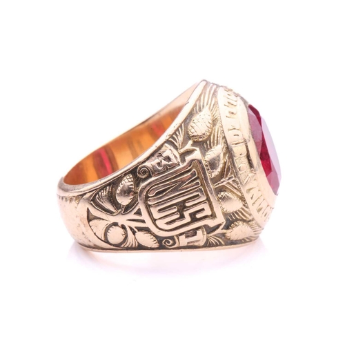 219 - A North Carolina State College 1931 class ring, set with synthetic ruby, shoulders featuring the Nor... 