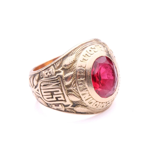 219 - A North Carolina State College 1931 class ring, set with synthetic ruby, shoulders featuring the Nor... 