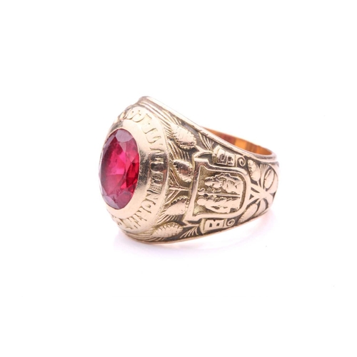 219 - A North Carolina State College 1931 class ring, set with synthetic ruby, shoulders featuring the Nor... 