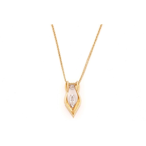 22 - An 18-carat gold and diamond pendant. with a marquise cut diamond measuring 7.0 x 2.8 mm with a roun... 