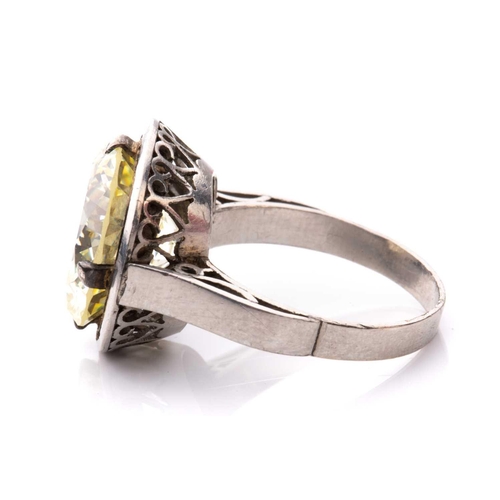 227 - A diamond solitaire ring, featuring a light yellow round brilliant-cut diamond of 8.62ct, mounted in... 