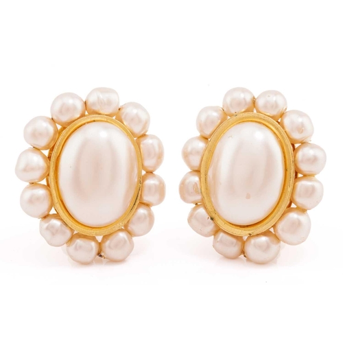 228 - Chanel - Two pairs of clip-on earrings; including a pair of cluster earrings, each centred with an o... 