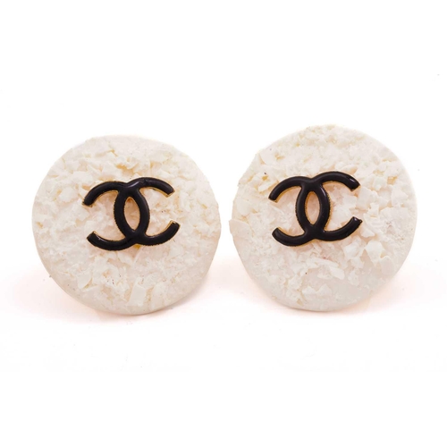 228 - Chanel - Two pairs of clip-on earrings; including a pair of cluster earrings, each centred with an o... 