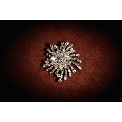 233 - Van Cleef & Arpels - A floral spray brooch set with diamonds, circa 1950, featuring a cluster of tie... 