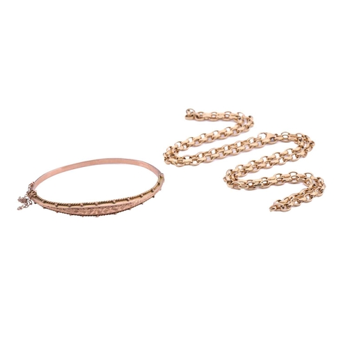 240 - An Edwardian 9ct gold hinged bangle and a 9ct gold chain; the bracelet contains a hollow band with a... 