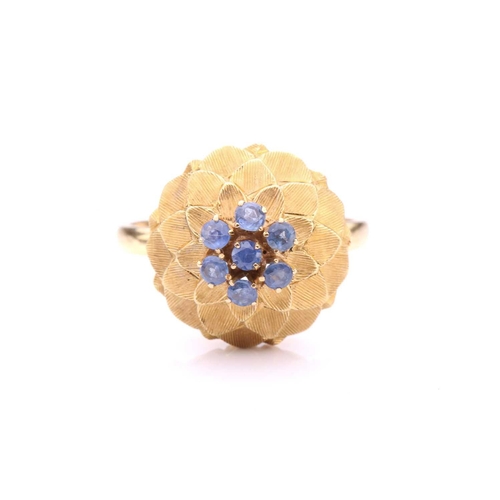 242 - A sapphire-set dome ring, in the form of an artichoke, centrally set with a cluster of seven circula... 