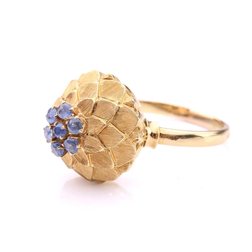 242 - A sapphire-set dome ring, in the form of an artichoke, centrally set with a cluster of seven circula... 