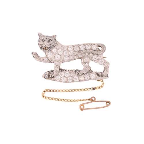 245 - A tiger passant diamond brooch, the walking feline has been fully encrusted with old-cut diamonds in... 