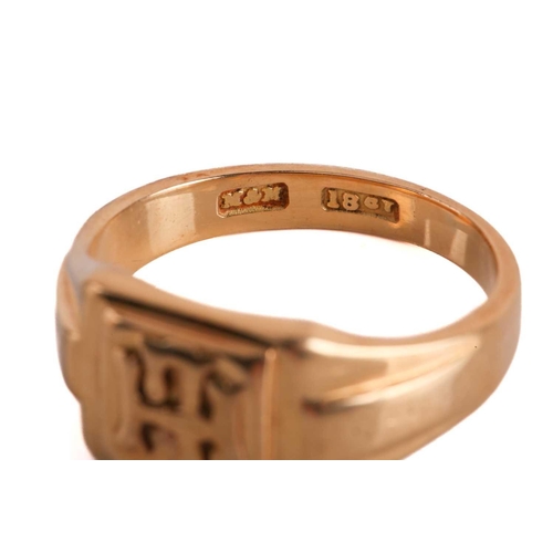 25 - A signet ring, a collar pin and a single cufflink; the signet ring comprises a raised square ring he... 