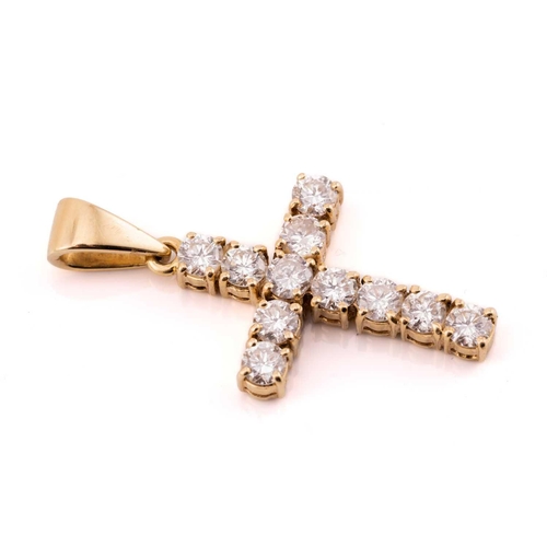 250 - A diamond cross pendant in 18ct yellow gold, containing eleven brilliant-cut diamonds of 3.3 mm in c... 