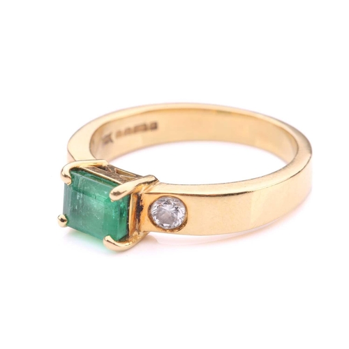 251 - An emerald and diamond dress ring in 18ct yellow gold, comprising an emerald-cut emerald in dark gre... 