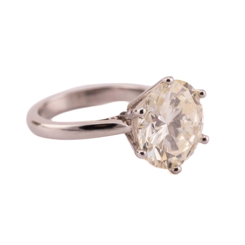 254 - A diamond solitaire ring in platinum, featuring a round brilliant-cut diamond of 6.51ct, mounted in ... 