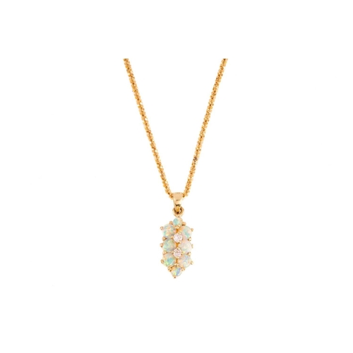 267 - A suite of synthetic opal jewellery, comprising a pendant necklace, the pendant set with nine round ... 