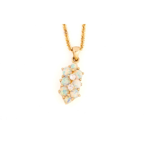 267 - A suite of synthetic opal jewellery, comprising a pendant necklace, the pendant set with nine round ... 