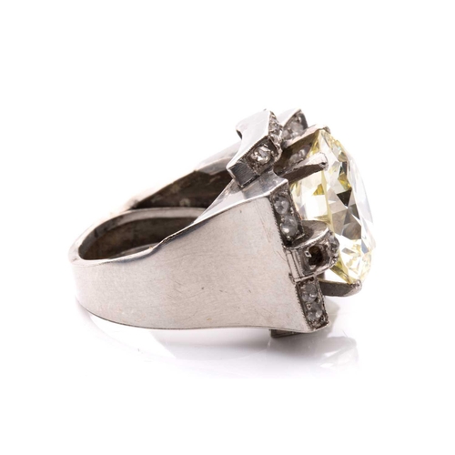 270 - An Art Deco style diamond cocktail ring, scintillating with a light yellow round brilliant-cut diamo... 