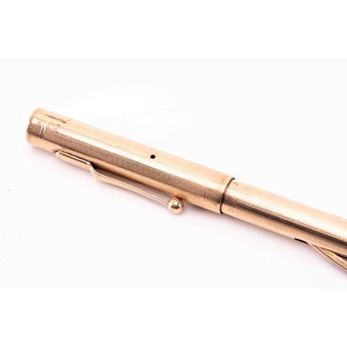 275 - A Mabie Todd & Co 'Swan' 9k gold fountain pen, circa 1925, with engine turned decoration, the body w... 