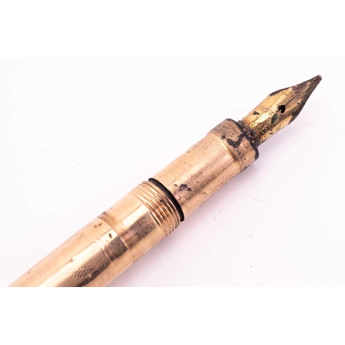 275 - A Mabie Todd & Co 'Swan' 9k gold fountain pen, circa 1925, with engine turned decoration, the body w... 