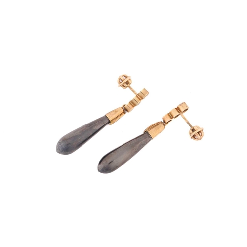 28 - A pair of hematite and diamond pendant earrings, each containing an elongated teardrop-shaped hemati... 