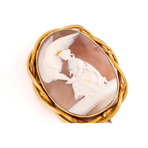 29 - A large Victorian shell cameo brooch, depicting a Classical scene of Hebe feeding the Eagle of Zeus,... 