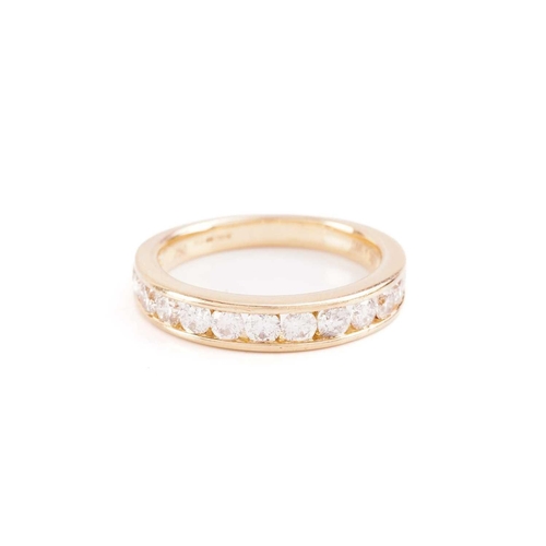 33 - A diamond half-eternity ring in 18ct yellow gold, channel-set with thirteen graduated brilliant-cut ... 